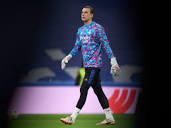 Real Madrid surround Andriy Lunin with love and support during a ...