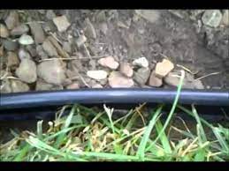 Either use long handled pliers to bend the stakes back and forth until the tab fatigues or leave them on and use colmet splicing stakes to create garden beds, driveways and more. Installing Plastic Landscape Edging Diy Youtube