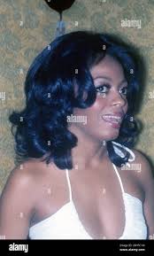 Diana Ross, singer, actress, in close-up, wearing white, smiling , at event  in New York, 1970s Photo: Oscar Abolafia/Everett Collection (dianaross001  Stock Photo