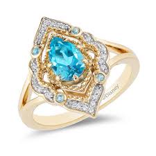 Enchanted Disney Aladdin Pear Shaped Swiss Blue Topaz And 1 10 Ct T W Diamond Arabesque Frame Ring In 10k Gold