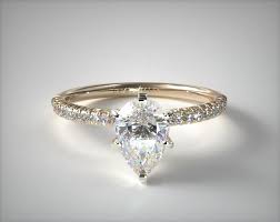 Blue nile single princess diamond and high polish inlay band in 14k yellow gold, $1,790, bluenile.com Best Pear Engagement Rings For Every Budget International Gem Society