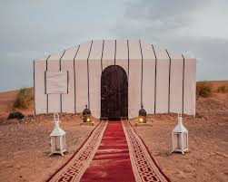 When bo and nocker are brought on camel to oasis el nooki, and are questioned by sheikh abdul abulbul, he suddenly is seen clutching his whip with both hands, where he had been holding his sword on his hip with his left hand. Staying At Tiziri Camp A Luxury Eco Camp In Morocco Tiziri Camp