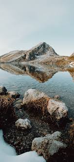 Download the best rocky mountains wallpapers backgrounds for free. Brown Rocky Mountain Beside Lake Under Blue Sky Du Nature Mountain Water Light Scenery Iphone11wallpaper Rocky Mountains Scenery Blue Sky