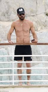 Unlike some people, justin theroux is very proud of his back tattoo.at the live recording of getting curious with jonathan van ness at vulture festival an audience member asked if justin could. Emma Stone Flaunts Bikini Body In White Two Piece On Vacation With Justin Theroux And Actress Pals Express Digest