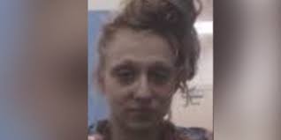 Woman accused of pouring gasoline