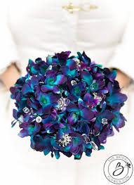 This elegant and playful slightly cascading bouquet is made with hand dyed turquoise light purple velvety galaxy orchids, real touch. Pin On One Day My Prince Will Come