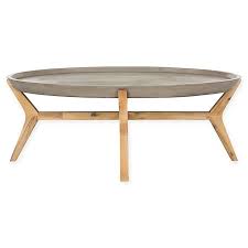 Unique textured panel pattern around sides. Safavieh Hadwin Oval Concrete Outdoor Coffee Table In Dark Grey Bed Bath Beyond