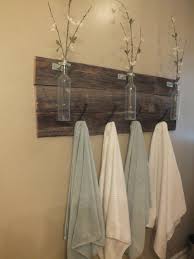 Beautiful bathroom design with wood vanity and recessed shelving for storage space Wood Towel Rack Ideas On Foter