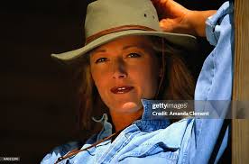 Portrait Of A Cowgirl Relaxing High-Res Stock Photo
