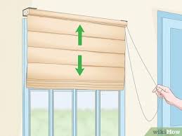 Measure the window to determine how long your roman shade needs to be. How To Hang Roman Shades With Pictures Wikihow