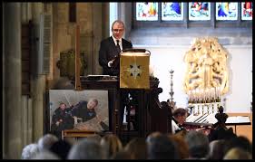 Standing with his young son, who had discovered hawking through his numerous appearances in the simpsons. 33 Pictures That Show The Emotional Church Funeral Held For Stephen Hawking Cambridgeshire Live