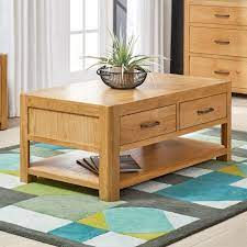 If you have young children or if you simply want a clean, uncluttered space, having extra storage in the form of coffee tables with drawers is sure to come in handy. Soho Oak Curved Coffee Table With 2 Drawers The Furniture Market