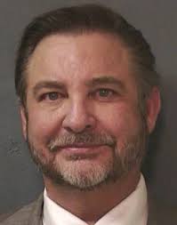 Arrested hand surgeon forfeits parental rights to 2 children