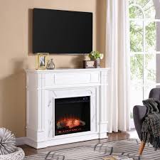 Clean, white finished woodwork evokes crown molding style from the base to the top, giving this electric fireplace grace and charm. Highpoint Faux Cararra Marble Touch Panel Electric Media Fireplace White Aiden Lane In 2021 White Electric Fireplace Electric Fireplace Home
