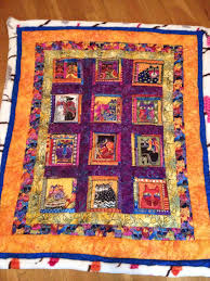 I created this fun little quilt that is purrrrrfect to hang on a wall or put on a table. Laurel Burch Cat Quilt Cat Quilt Patterns Cat Quilt Laurel Burch Fabric