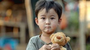 Free Child Holding Teddy Image
