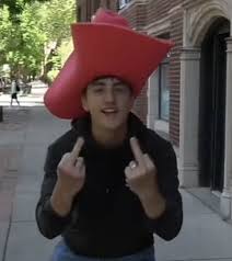 Danny wearing a cowboy hat flipping the camera off