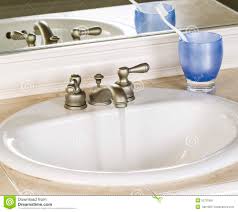 white bathroom sink and faucet in open