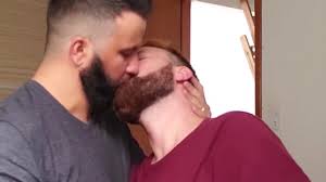 Two men kissing