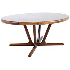 It's crafted from solid wood, with either an oak or walnut wood grain tone, and has a rounded surface set on four oval legs. 12 Person Dining Table 6 For Sale On 1stdibs