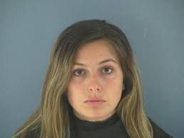 Woman accused of discharging firearm in church parking lot