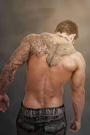 Geometric bulls taurus tattoo for men on upper back. 110 Dazzling Upper Back Tattoos And Designs