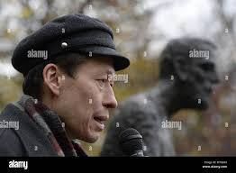 In this Wednesday May 17, 2017 photo, Annette Charnock, wife of waterman Ed  Charnock, gestures during an interview in front of her home in Tangier, Va.  Tangier Island in the Chesapeake Bay