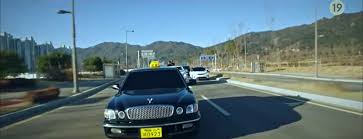 Kim do ki is a mysterious driver . Taxi Driver Korean Drama Review A Team Helps Others Get Revenge