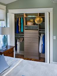 An additional wardrobe closet with drawers flanks either side of the central hanging units. Tips On Choosing Built In Storage Diy