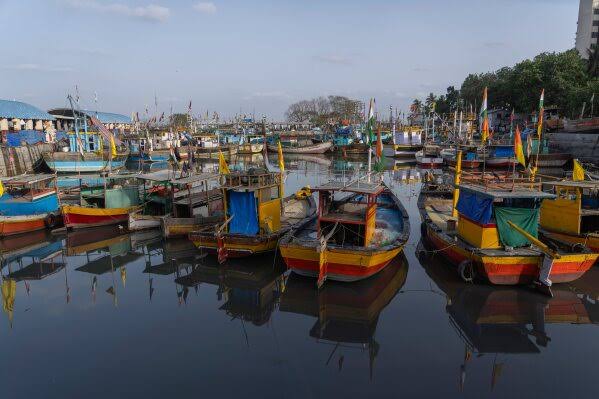 Boats sit idle at Mumbai's historic dock as Iran war drives up fuel costs, in photos | AP News
