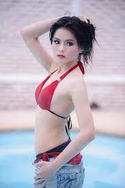 Asia sexy young girl standing near swimming pool Stock Photo by ©thegoatman  81819098