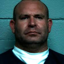 Prison guard charged with planting drugs in vehicle