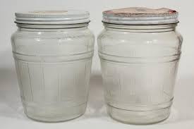 old glass barrel herring jars