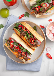 It is often split lengthwise and filled with savory ingredients like a submarine sandwich and served as a meal. Pulled Mushroom Banh Mi So Vegan