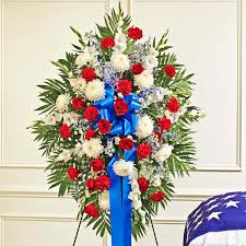 Sending blue flowers as a gift are perfect for congratulating parents on the birth of their new baby boy and as congratulations for achieving something difficult or ambitious. Red White Blue Sympathy Standing Spray Standing Sprays