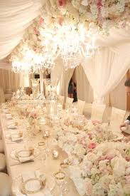 These White Filmy Curtains Chairs Flowers And Decor Plus The Pretty Chandeliers Is Over The Top In Fem Long Table Wedding Upscale Wedding Decor Wedding Table