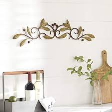 Geometric animal drawings used as wall decoration. Amazon Com Deco 79 63084 Metal Wall Decor 31 W 6 H 31 X 6 Rustic Home Kitchen