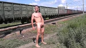 Walking naked by railroad