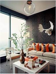 Colorful pillows, artwork and warm colors create a cozy sitting area for the family. Natural Color Earth Colors In Brown Living Room Interior Design Ideas Ofdesign