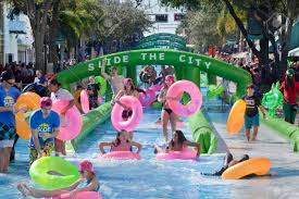 Storefronts logically multiplied and lined each way, as clematis became the main street of west palm beach. A 1000 Foot Long Water Slide Is Set Up On Clematis Street In Downtown West Palm