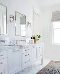 White Bathrooms With Silver Accents And Polished Chrome Fixtures Bathroomfixturesideas White Master Bathroom White Vanity Bathroom Bathroom Remodel Master