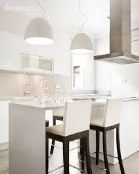 Las cocinas con isla son una de las opciones que más se recomiendan si se dispone del suficiente espacio, si desas una cocina con isla te en tpc cocinas disponemos de todo tipo de encimeras, ya sea de porcelánico, de cuarzo, de granito o mármol, o nuestras encimeras especiales mensystem. Cocina Con Isla De Coccion Y Mesa De Desayuno