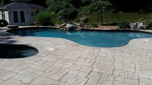 The raised portion of the pool wall. Stamped Concrete Pool Decking3 The Blue Lagoons