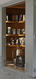 Grey Bi Fold Kitchen Cupboard Doors Reveal Wooden Shelving Inside A Larder Cupboard For Food A Kitchen Cupboards Kitchen Cupboard Doors Kitchen Storage Shelves