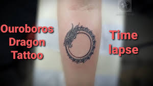 Originating in ancient egyptian iconography, the ouroboros entered western tradition via greek magical tradition and was adopted as a symbol in gnosticism and hermeticism and most notably in alchemy. Tattoo Ouroboros Dragon Time Lapse By Ancient Tattoo Youtube