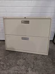 Hon® brigade™ 600 series lateral file cabinet in charcoal color measuring 28 3/8 x 36 x 19 1/4 includes two drawers for holding letter/legal size files. Hon Putty Metal 2 Drawer Lateral Filing Cabinet 36 Inch Wide Hon