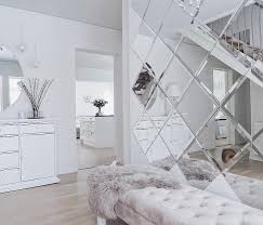 The bed is dressed in custom linens by e. How To Use Decorative Mirror Tiles In Interior Design
