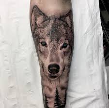Black And Grey Realism Wolf Tattoo Black And Grey Ink Realistic Wolf Tattoo By Fervescent Wolf Tattoos Animal Tattoo Animal Tattoos