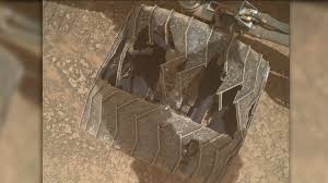 Curiosity Mars rover inspects cracked wheel photo of the day for July 27, 2026