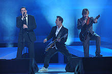 Also a bassist, he and his younger brother gary kemp are members of the new wave band spandau ballet. Spandau Ballet Wikipedia